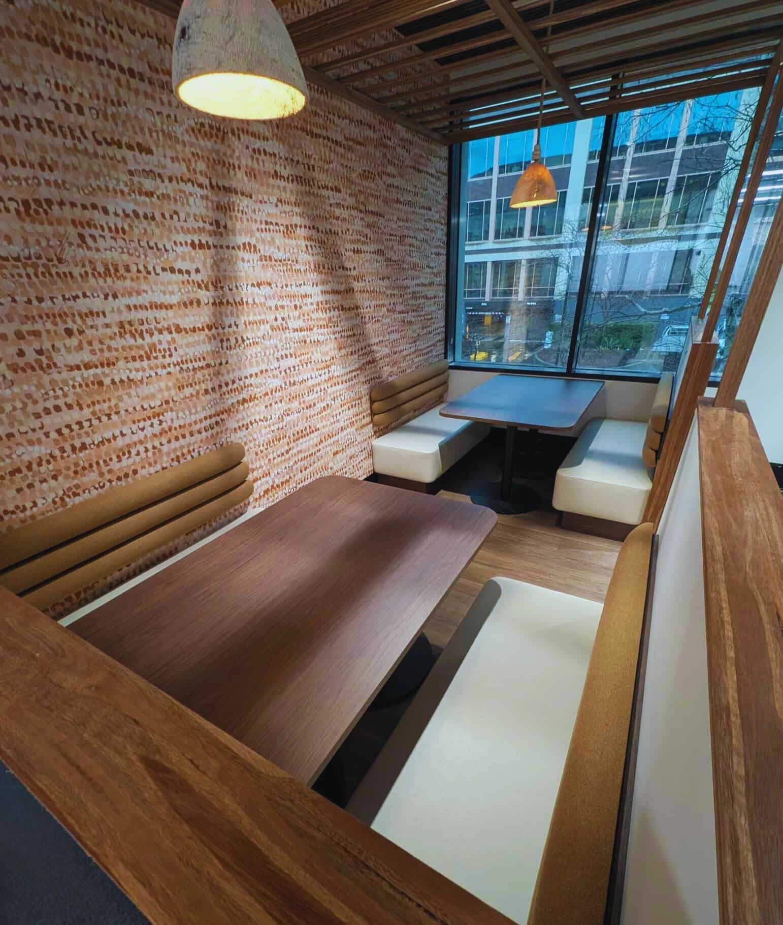 Modern commercial office fit-out with workstations and glass partitions